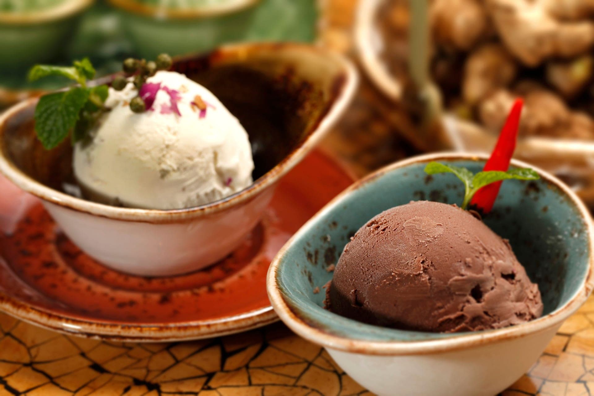Bowls of chocolate and vanilla ice cream served side by side